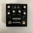 Černý kytarový pedál s nápisy IRIDIUM, amp & ir cab a značkou strymon. Na horní straně jsou čtyři ovládací knoflíky s popisky DRIVE, MIDDLE, TREBLE a…
