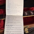 Fotografie zobrazuje papírový kontrolní seznam s názvem QUALITY CHECKLIST. Dokument obsahuje několik sekcí: EXTERIOR FINISH, PLAYABILITY, CASE INSPEC…