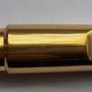 Zlatý kovový h mouthpiece s černým náústníkem. Na povrchu je vyryté logo „Dubosc“ a text „MADE IN FRANCE“. Povrch vykazuje drobné škrábance a známky…