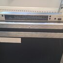 Stříbrný rackový digitální ladič s nápisy DTR-2 DIGITAL TUNER a TONEWORKS. Na předním panelu je vidět stupnice v centech od -50 do +50 a spodní škála…