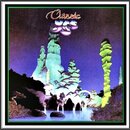 Obal CD s nápisem Classic YES v horní části. Obrázek zobrazuje surrealistickou krajinu s vysokými, světle zelenými skalními útvary u vodní plochy pod…