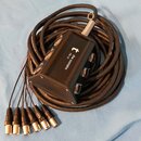 Černý kabelový rozvod s ovládací boxou, na které je bílý nápis the SSSnake a model M16-10 spolu s logem ve tvaru písmena t. Box má několik kovových k…