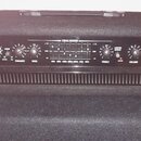Černý basový zesilovač značky Laney, model RB9 Richter Bass. Přední panel obsahuje několik ovládacích knoflíků (Gain, Active, Enhance, Bass, Treble,…