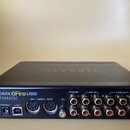 Černý externí zvukový interface s nápisem DMX 6Fire USB a značkou TERRATEC. Zařízení má na zadní straně konektory POWER, USB, dva MIDI porty (IN a MI…