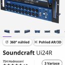 Modrá digitální mixovací konzole v rackovém provedení s černými úchyty. Na předním panelu je bílý nápis Soundcraft Ui24R a další menší nápisy, včetně…