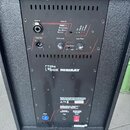 Zadní strana černého reproduktoru s nápisem the ubox MINIRAY. Jsou zde vidět vstupy Line In, výstupy Line Out a ovládací prvky Sub Level, Low Pass a…
