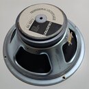 Fotografie zachycuje zadní stranu reproduktoru s kovovým rámem stříbrné barvy. Na magnetu je bílá nálepka s nápisy PROFESSIONAL LOUDSPEAKER, CELESTON…