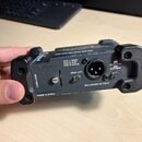 Černý elektronický přístroj s konektorem XLR označeným jako BALANCED OUTPUT. Na šasi jsou viditelné nápisy PIN 1 GND, PIN 2 HOT, PIN 3 COLD, GND LIFT…