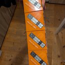Čtyři oranžové krabičky s nápisem SELECTED TUBES PREMIUM QUALITY. Každá krabička má bílou nálepku s logem Tube Amp Doctor a označením 6V6GT-STR, PC:…