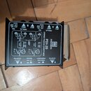 Černá pasivní DI box s nápisem STEREO PASSIVE DIRECT BOX a označením modelu PDI-20 pod logem PRONOMIC. Zařízení má na horní straně přepínače PAD a PA…