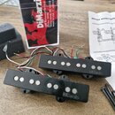 Dvě černé kytarové snímače typu humbucker s viditelnými bílými póly. Na obou snímačích je vyražen nápis DiMarzio. Součástí je papírový návod s názvem…