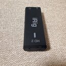 Černý obdélníkový audio rozhraní s nápisem iRig a označením HD 2. Na horní hraně jsou vidět symboly pro kartu a napájení. Povrch je matný s mírnými z…