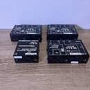Čtyři černé kovové boxy značky ROLLS. Dva z nich mají nápis Personal Monitor Station PM351 a dva jsou označeny jako PERSONAL MONITOR POWER CENTER PM1…