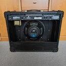 Zadní strana černého kytarového komba s koženým povrchem. Na horním panelu je bílý nápis STUDIO PRO-112 a logo PEAVEY. Uprostřed je viditelný reprodu…