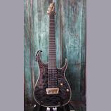 Elektrická kytara s tmavým, mramorovaným povrchem těla a černým hmatníkem. Na hlavě je bílý nápis Ibanez. Nástroj má dva humbuckery, jeden ovládací k…