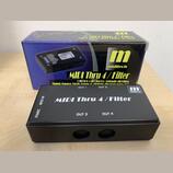 Černý MIDI box s nápisem MIDI Thru 4 / Filter a logem miditech. Zařízení má na horní straně označení PANIC, MIDI IN a výstupy OUT 1 až OUT 4. V pozad…