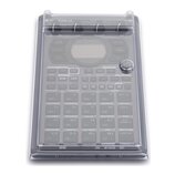 Průhledný sampler s ovládacími prvky a displejem, umístěný v plastovém krytu. Na zařízení jsou vidět nápisy Roland, PATTERN SEQUENCER, SAMPLE EDIT a…