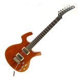 Elektrická kytara s hnědým dřevěným korpusem a tmavým hmatníkem. Nástroj má dva humbuckery s krémovými rámečky, jeden tónový potenciometr a jeden pře…