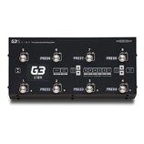 Černý spínací systém s nápisy G3 S A T O M The advanced switching system a webovou adresou THEGIGRIG.com. Zařízení má osm kovových spínačů označených…
