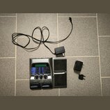 Stříbrný kytarový procesor s černým integrovaným reproduktorem. Na přístroji jsou nápisy "Contax", "RP200" a dvakrát "DigiTech". Součástí je napájecí…
