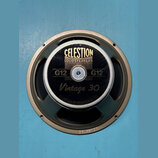 Fotografie znázorňuje reproduktor s hnědým kovovým rámem. Na černém středovém krytu jsou zlaté nápisy CELESTION LOUDSPEAKERS, G12, Vintage 30 a CELES…