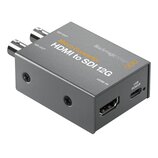 Šedý kovový konvertor s nápisy Micro Converter, HDMI to SDI 12G a Blackmagicdesign. Zařízení má dva výstupy označené jako SDI OUT, jeden vstup HDMI I…
