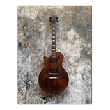 Hnědá elektrická kytara s tvarem single-cut a tmavým hmatníkem s trapezoidními vložkami. Na hlavě je bílý nápis Gibson. Kytara má dva humbuckery, Tun…