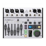 Bílý digitální mixér značky behringer s označením FLOW8 Bluetooth Controlled Digital Mixer. Zařízení má v horní části čtyři vstupy, několik výstupů a…