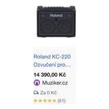 Černý kombozesilovač s mřížkou z kovového pletiva a dvěma reproduktory. Na horní části mřížky je bílý nápis Roland. Horní panel obsahuje několik ovlá…