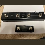 Na fotografii jsou dvě černé kovové zařízení značky HOTOHE. Horní je Bluetooth MIDI Controller s nápisem AMPERO CONTROL, čtyřmi stomačními spínači oz…