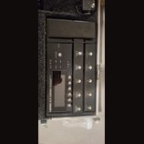 Černý kytarový procesor BOSS GT-1000 umístěný v transportním kufru. Na přístroji jsou viditelné nápisy GUITAR EFFECTS PROCESSOR, AIRD a ovládací prvk…