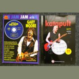 Fotografie zobrazuje dvě publikace: vzdělávací materiál pro kytaru a zpěvník. Vlevo je modrý sešit s nápisy JAM with GARY MOORE, Guitar Tablature a T…