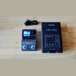Na fotografii je černý kytarový multiefekt s nápisy MULTI-EFFECTS PROCESSOR, PARA VALETON a GP-50. Zařízení má displej, čtyři ovládací knoflíky, něko…