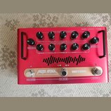 Červený kytarový zesilovač s nápisem NANO LEGACY FLOOR. Na horní straně jsou dvě řady ovládacích potenciometrů s popisky BASS, MIDDLE, TREBLE, GAIN a…