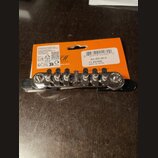 Kytarový kobylník s vibrační pákou v chromovaném provedení, umístěný na oranžovém originálním obalu. Na obalu je uveden text BRIDGE, SYNCHRO-TONIC, N…