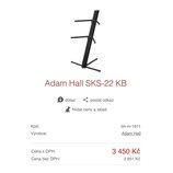 Fotografie znázorňuje černý kovový stojan na hudební nástroje s několika rameny. Pod obrázkem je uveden název modelu Adam Hall SKS-22 KB a u výrobce…