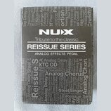 Krabice efektového pedálu značky NUX z řady REISSUE SERIES. Na přední straně je bílý nápis NUX a text Tribute to the classic ANALOG EFFECTS PEDAL. Po…