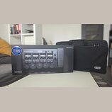 Krabice s nápisem ZOOM G5n Multi-Effects Processor a doprovodný černý polstrovaný pouzdro. Na krabici je vidět obrázek efektového procesoru a modrý š…