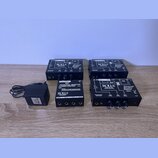 Na fotografii jsou čtyři černé kovové boxy s ovládacími prvky a konektory. Tři z nich mají nápisy ROLL'S MADE IN USA, www.rolls.com a Personal Monito…