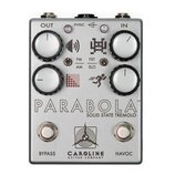 Stříbrný efektový pedál s nápisem PARABOLA SOLID STATE TREMOLO. Na horní straně jsou čtyři bílé otočné knoflíky a dva přepínače s popisky FM/AM a FST…