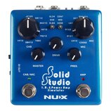 Modrý kytarový pedál s nápisem Solid Studio I.R.& Power Amp Simulator a logem NUX. Zařízení má pět černých otočných ovladačů s popisky CAB, DRIVE, MI…