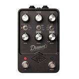 Černý kytarový pedál s nápisem Dream 65 REVERB-AMP. Obsahuje šest stříbrných otočných knoflíků s popisky VOLUME, REVERB, OUTPUT, BASS, TREBLE a BOOST…