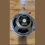 Kruhové reproduktory s kovovým rámem a černou membránou. Na středovém štítku jsou nápisy Marshall AMPLIFICATION, Heritage, Part No.S311f, G12 a 8 Ω.…