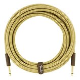 Zvitý instrumentální kabel s pleteným obalem v žluté barvě. Na hnědé koženkové stahovací pásce je bílý nápis Fender. Kabel má na koncích hnědé konekt…