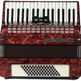 Červená akordeon s perleťovým povrchem a bílými klávesami. Na přední straně je nápis ROYAL STANDARD a v dolní části nápis Canelia. Spodní bílý panel…