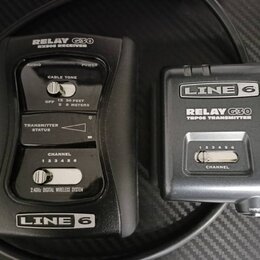 Černý bezdrátový systém Line 6 Relay G30 složený z přijímače a vysílače. Na přijímači jsou nápisy RELAY G30 RX500 RECEIVER, AUDIO, POWER, CABLE TONE,…