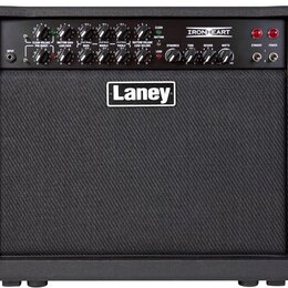 Černý kytarový kombo zesilovač s textilem přes reproduktor. Na horním ovládacím panelu je nápis IRONHEART a uprostřed mřížky bílo-černé logo Laney. P…