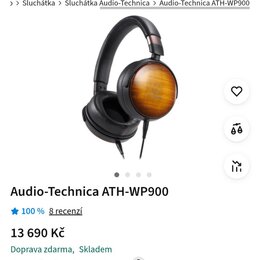 Snímek zachycuje černá uzavřená sluchátka s náušníky z hnědého dřeva s viditelnou strukturou zrn. Na stránce je uveden název modelu Audio-Technica AT…