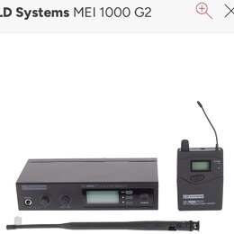 Černý bezdrátový vysílač a přijímač. Na vysílači je nápis LD SYSTEMS, MEI1000G2 UHF PLL STEREO TRANSMITTER a tlačítka SET s šipkami oraz POWER. Přijí…