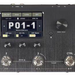 Černý efektový procesor s nápisem AMPERO Amp Modeler / Effects Processor. Zařízení má digitální displej s textem P01-1, WelcomeToAmpero a hodnotami A…